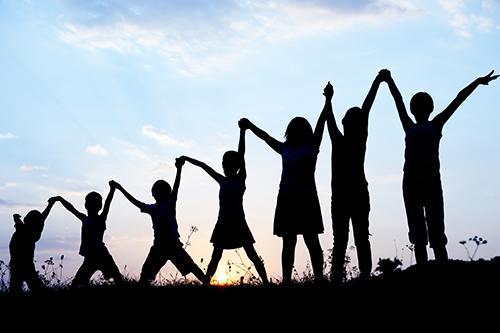 children holding hands.