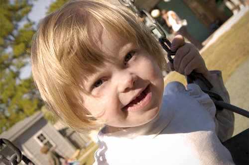 Young girl with disabilities in a swing.